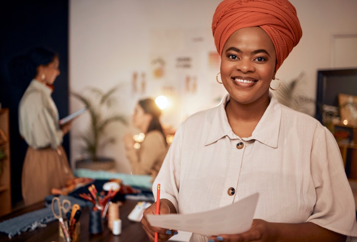 Management, fashion and designer with portrait of black woman in workshop studio for manufacturing,