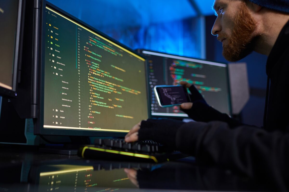 Hacker breaking the system on computers
